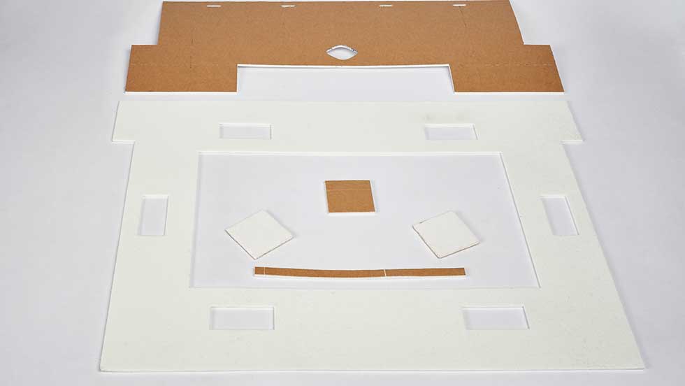 300dpi 19 027 62 White and tan insulation pieces cut with an industrial water jet cutter.
