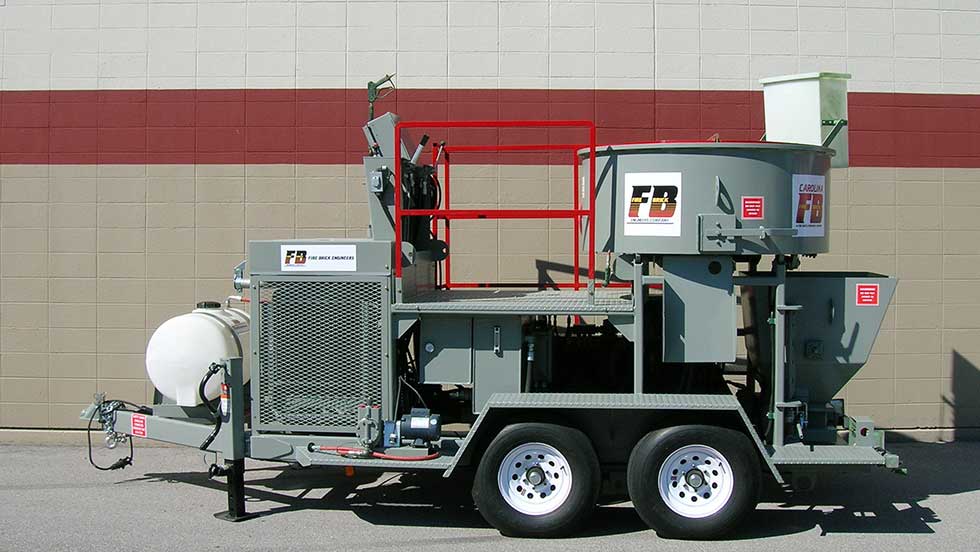 FBC MX 10 P1 A photo of a Blastcrete Model MX-20CM mixer/pump -- large piece of industrial refractory installation machinery mounted on a trailer base.